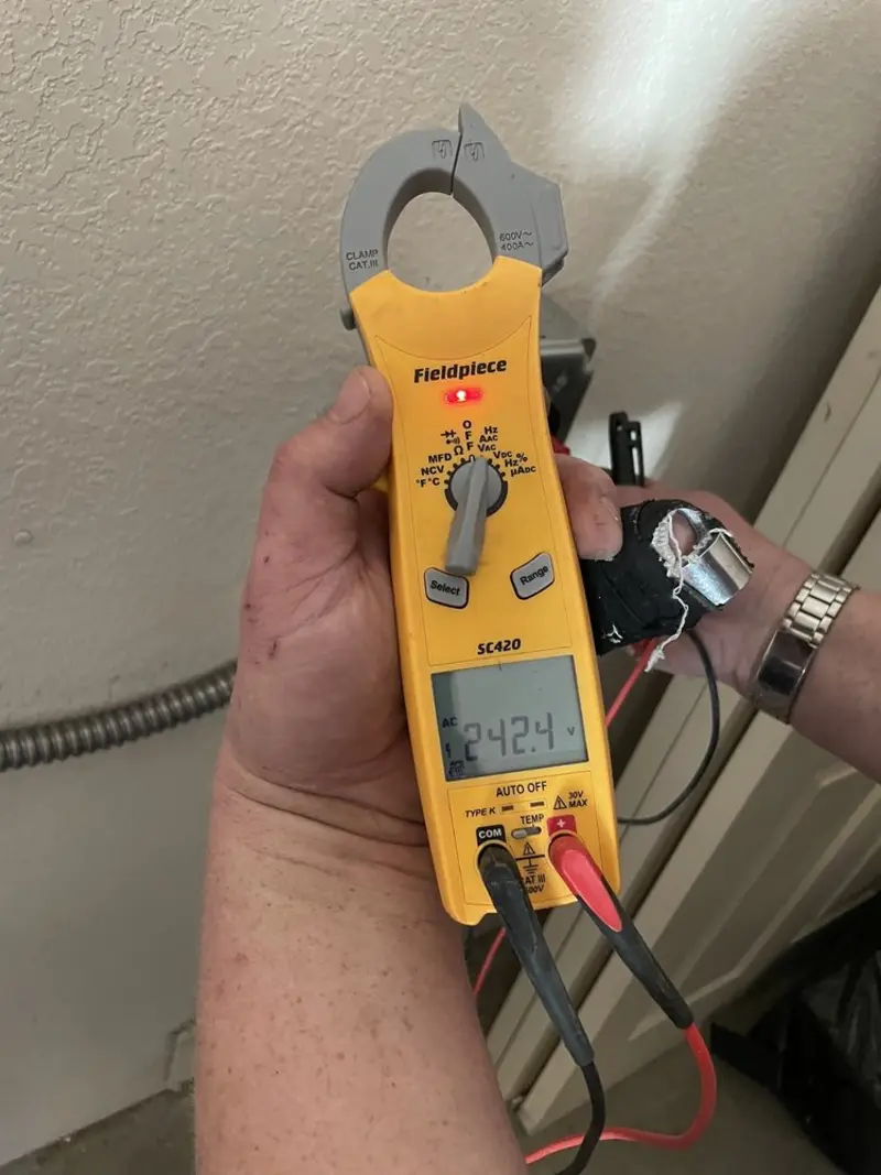 Voltage testing with clamp meter during Electrical Installation Services in Shenandoah Farms